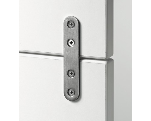 Metallförbindningsjärn med fyra skruvar för att fästa två möbler.