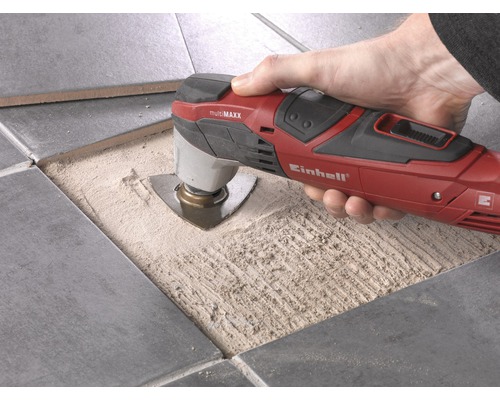 Enhands multifunktionsverktyg som används för att skära plattor