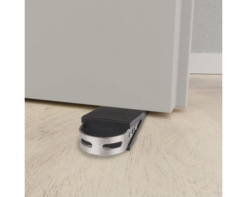 Dörrstopp av metall och gummi säkrar en dörr