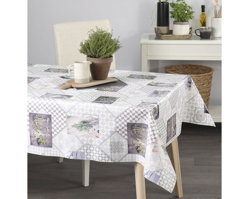 Matbord med gråmönstrad duk, örtmönster