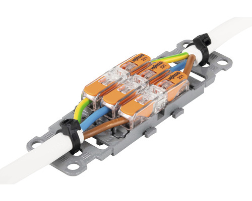 Wago kopplingsplintar i 221-serien med tre elektriska ledningar i ett fäste.