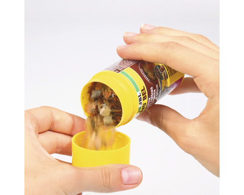 JBL Novo Bel flingfoder hälls i ett gult lock