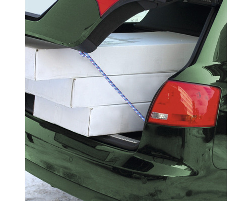 Lastsäkring med spännband i bagageutrymmet på en bil