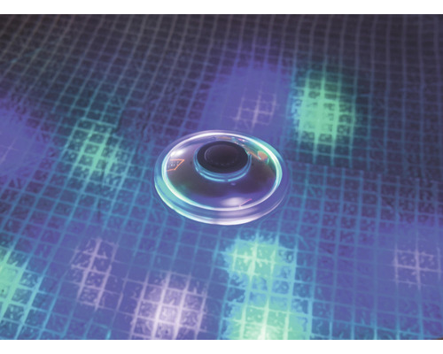 Rund LED-spotlight på mönstrad bakgrund