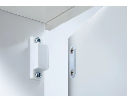 Vit magnetisk dörrstängare fäst på möbler