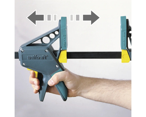 Enhandstving Wolfcraft med pilar som visar spännriktningen