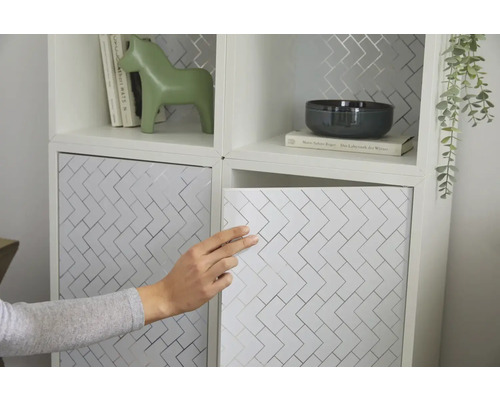 Dekorativt förvaringssystem med geometriskt mönster och förvaringsutrymme