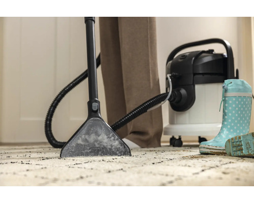 Mattrengöringsapparat i bruk på en matta