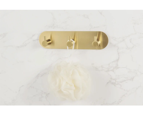 Väggmonterad hängare med tre krokar och badsvamp