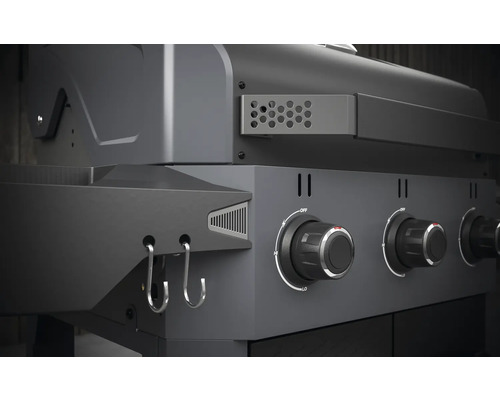 Detaljvy av gasolgrill med kontrollknappar och krokar