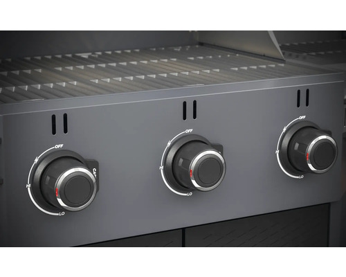 Närbild av en gasgrill med tre vridreglage för temperaturkontroll