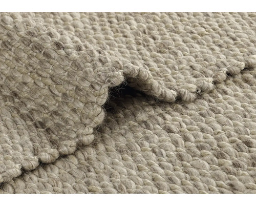 Närbild av en vikt matta i naturfiber