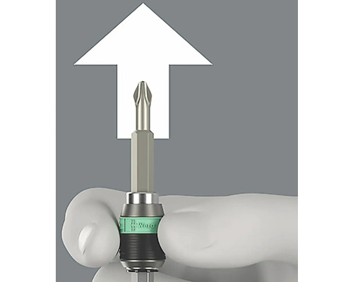 Ett Phillips skruvmejselbit med en vit markering, hålls av en hand.