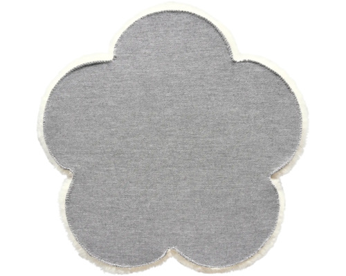 Blomformad matta med textur och kant