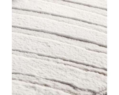 Närbild av en vit matta med struktur