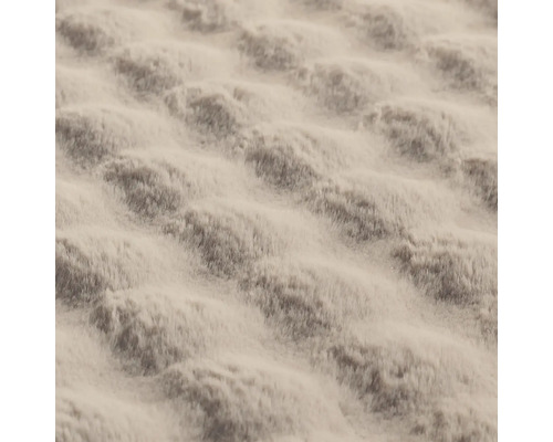 Närbild av ett mjukt tyg med mönster