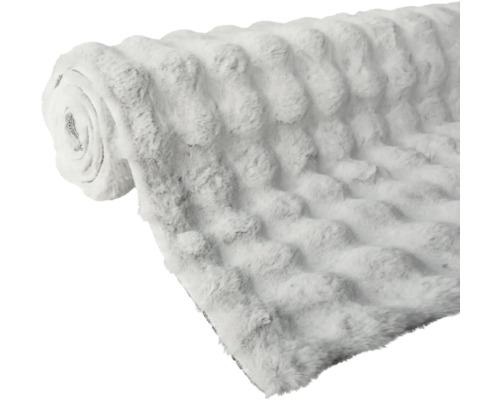 Rullad gosig filt med noppstruktur