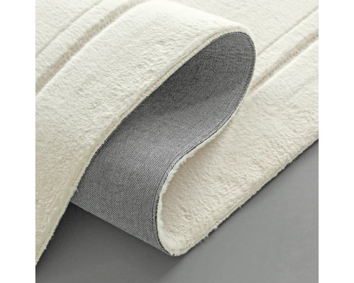 Detaljvy av en vit matta med struktur