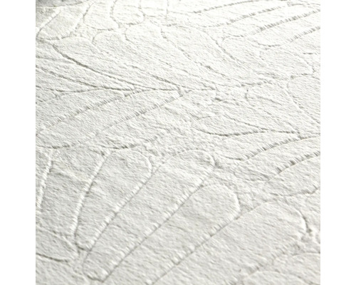 Närbild av en vit texturerad tapet med bladmönster