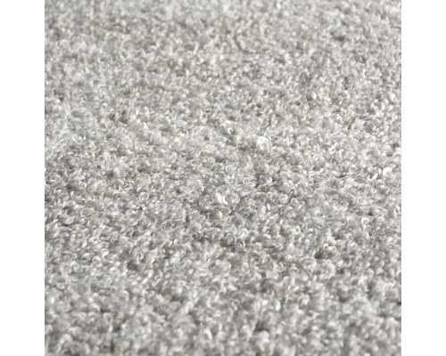 Närbild av en grå matta med öglad struktur