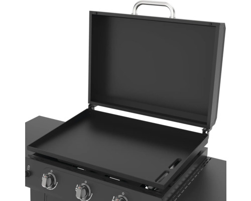 Öppen stekplatta med lock och reglage.