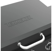Detaljvy av en Tenneker grill med lock och handtag