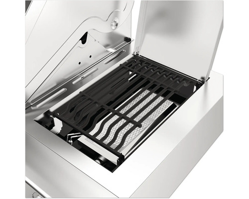 Inre vy av en gasgrill med grillgaller