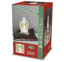 Förpackning med en snöglobslykta för inomhusbruk från Konstsmide med LED-belysning och timerfunktion