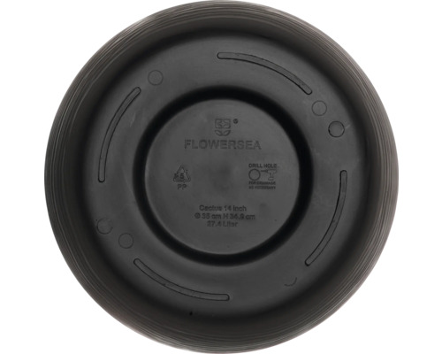 Blomkrukans undersida med tillverkarinformation och borrinstruktioner