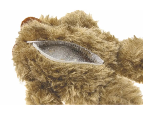 Detaljvy av en teddybjörn med dragkedja och stoppning