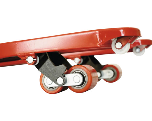 Detaljvy av en möbelrulle med röda och vita hjul.