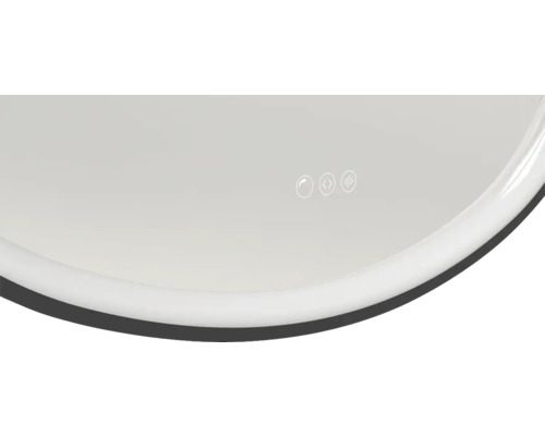 Detaljvy av en spegel med beröringssensor och värmefunktion