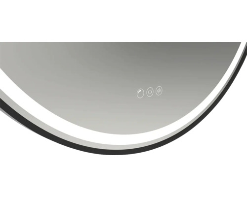 Delvis bild av en rund spegel med pekkontrollpanel