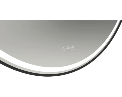 Detaljvy av en rund spegel med ljus och kontrollpanel