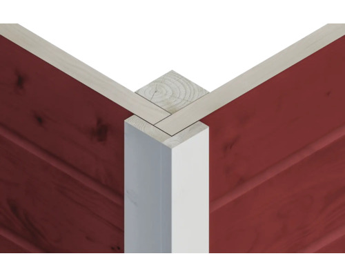 Detaljvy av ett hörnbeslag i trä med röd väggbeklädnad