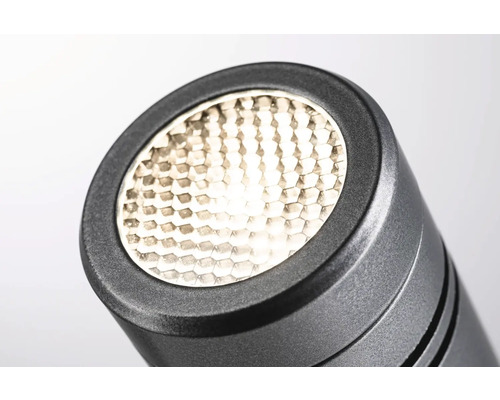 Närbild av en svart lampa med honeycomb-mönster