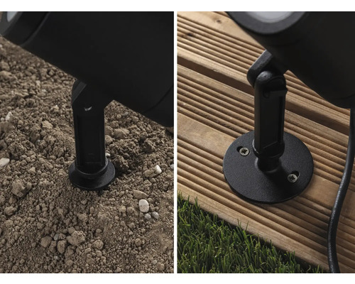 Detaljbild av en utomhuslampa med jordspett och monteringsplatta på mark och träterrass