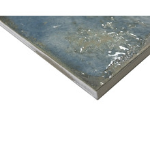 Närbild av en glaserad väggplatta