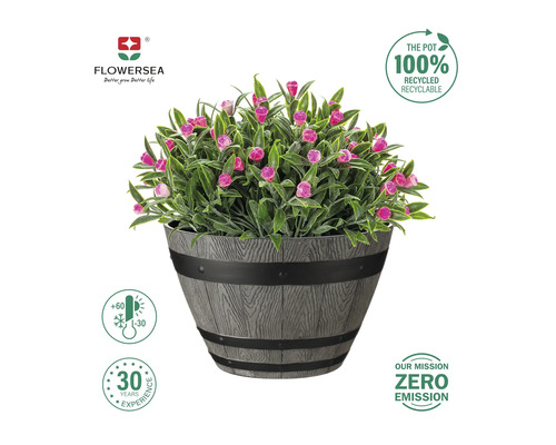Konstgjord växt med rosa blommor i en grå kruka i trädesign