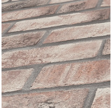 Närbild av en tapet med tegelstensdesign