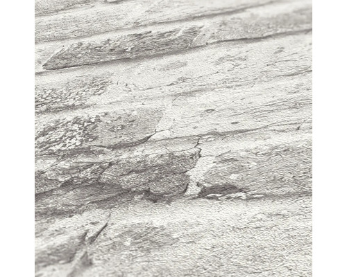 Närbild av en stentapet med strukturerade detaljer