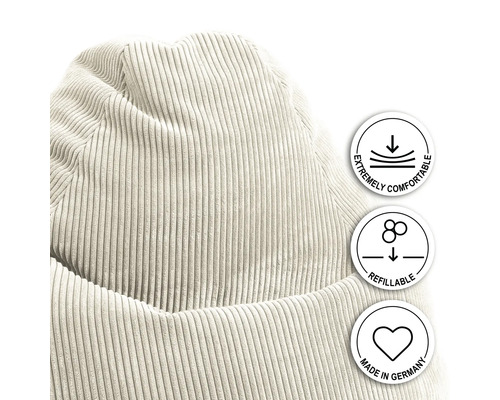 Närbild av en sittpuff i manchester med symbolerna extremt bekväm, påfyllningsbar och tillverkad i Tyskland