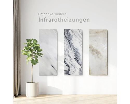 Tre infraröda värmare med marmorlook på en vägg