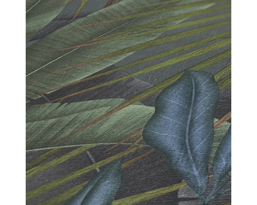 Närbild av en tapet med tropisk bladdesign