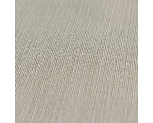 Närbild av en beige tapet med linnestruktur