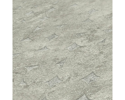 Närbild av en grå vinylgolvplatta med en texturerad yta