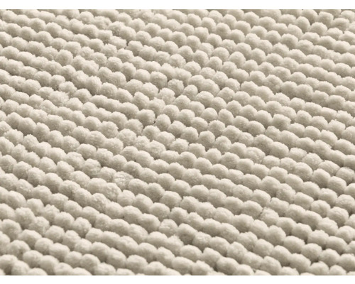 Detaljvy av en badrumsmatta i bomull med noppstruktur