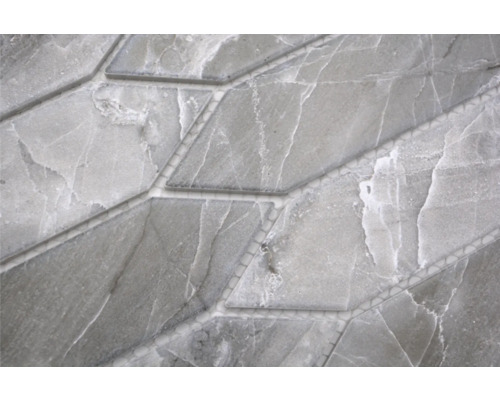 Detaljbild av en grå marmormosaikplatta