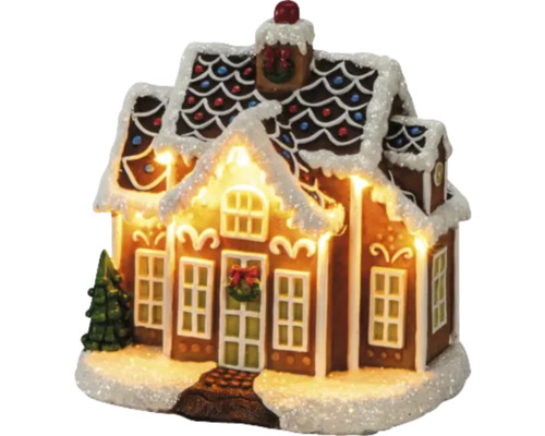 Pepparkakshus med belysning och dekoration