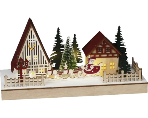 Juldekoration med jultomten, renar, hus och träd